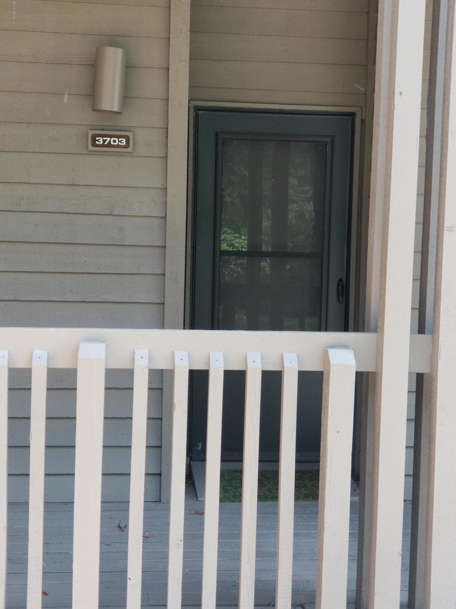 3175 Ravines Road, Unit 3703 Middleburg, FL 32068 - Photo 2 of 13 a view of wooden door