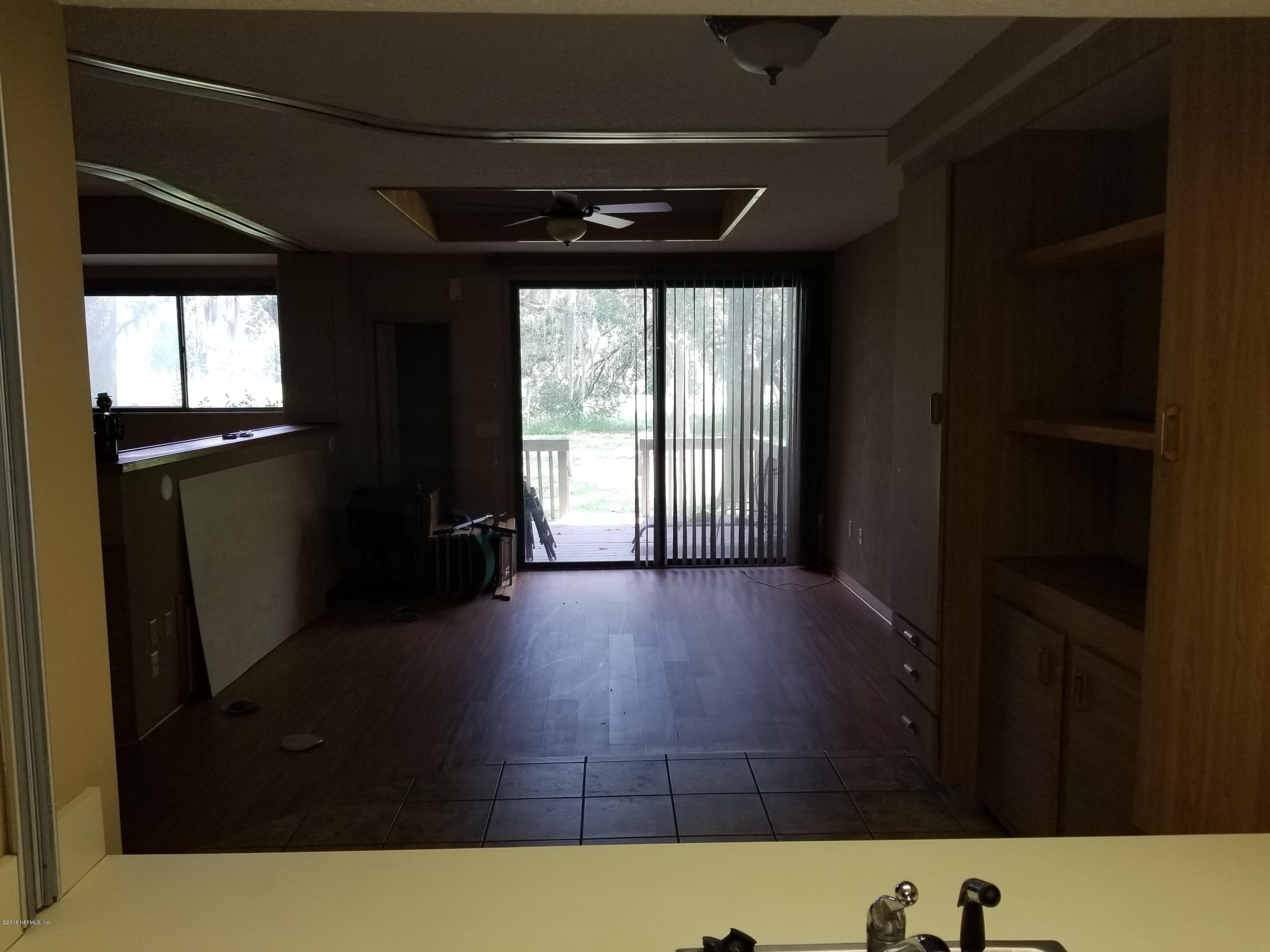 3175 Ravines Road, Unit 3703 Middleburg, FL 32068 - Photo 5 of 13 a view of an empty room with a window