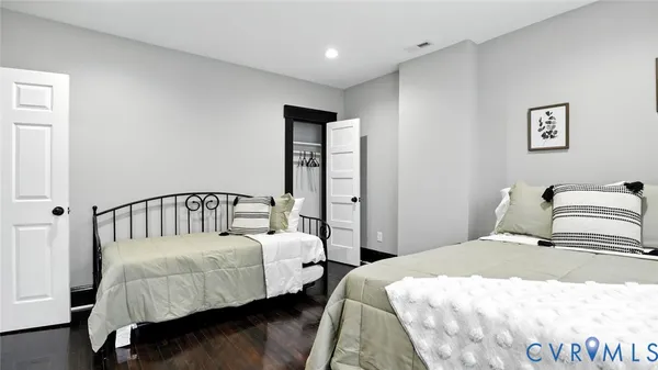 a bedroom with bed and window