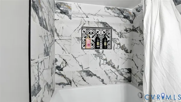 a bathroom with a toilet a sink and a window