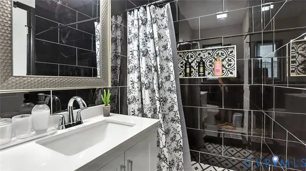 a bedroom with a bed and a chair