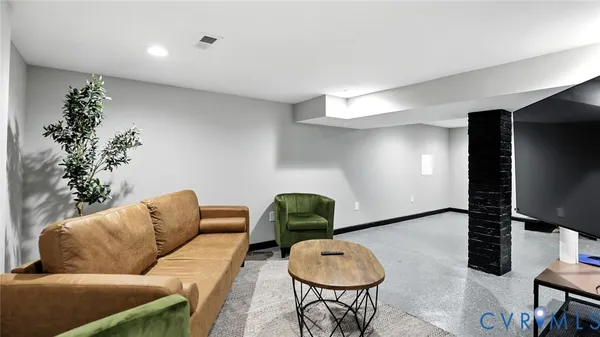 a view of a hallway with seating area