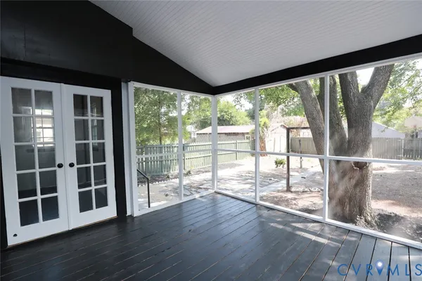 a view of a backyard with a tree