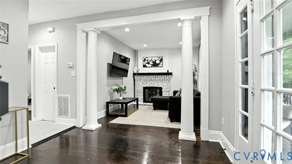 a view of a livingroom with furniture and a fireplace