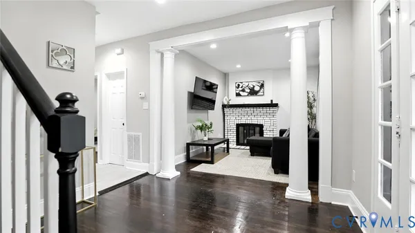 a living room with furniture and a fireplace