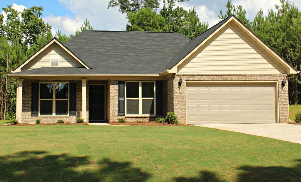 965 Weldon Road Forsyth, GA 31029 - Photo 1 of 11 a view of a house with a garden