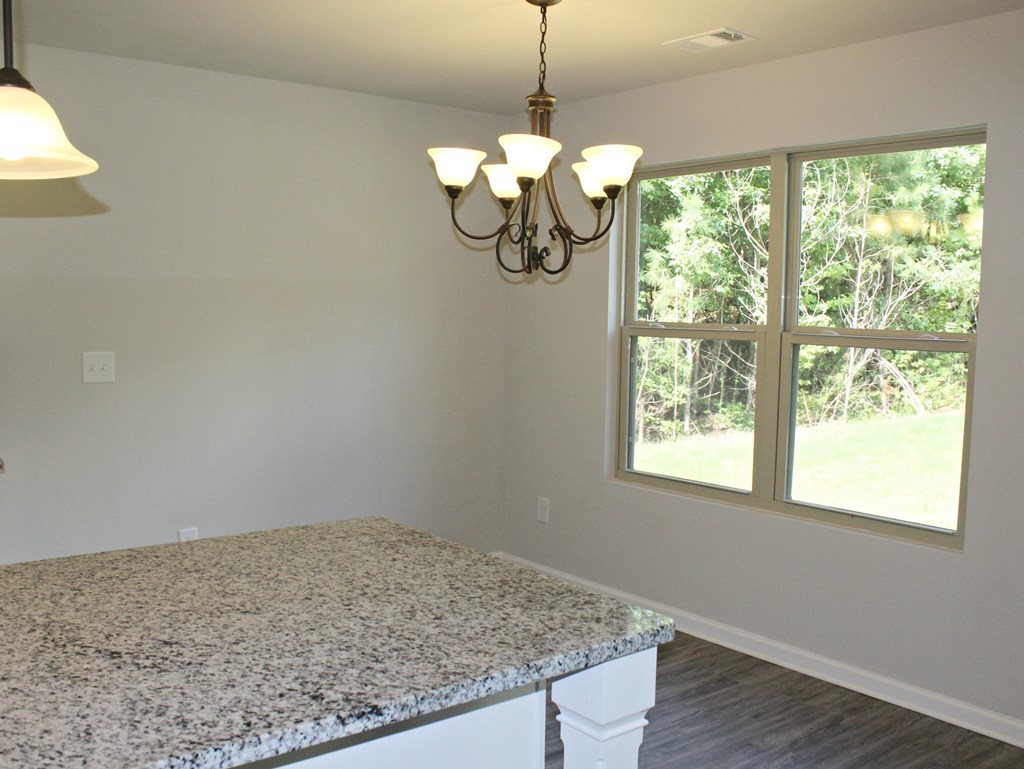 965 Weldon Road Forsyth, GA 31029 - Photo 6 of 11 a view of a livingroom with a chandelier