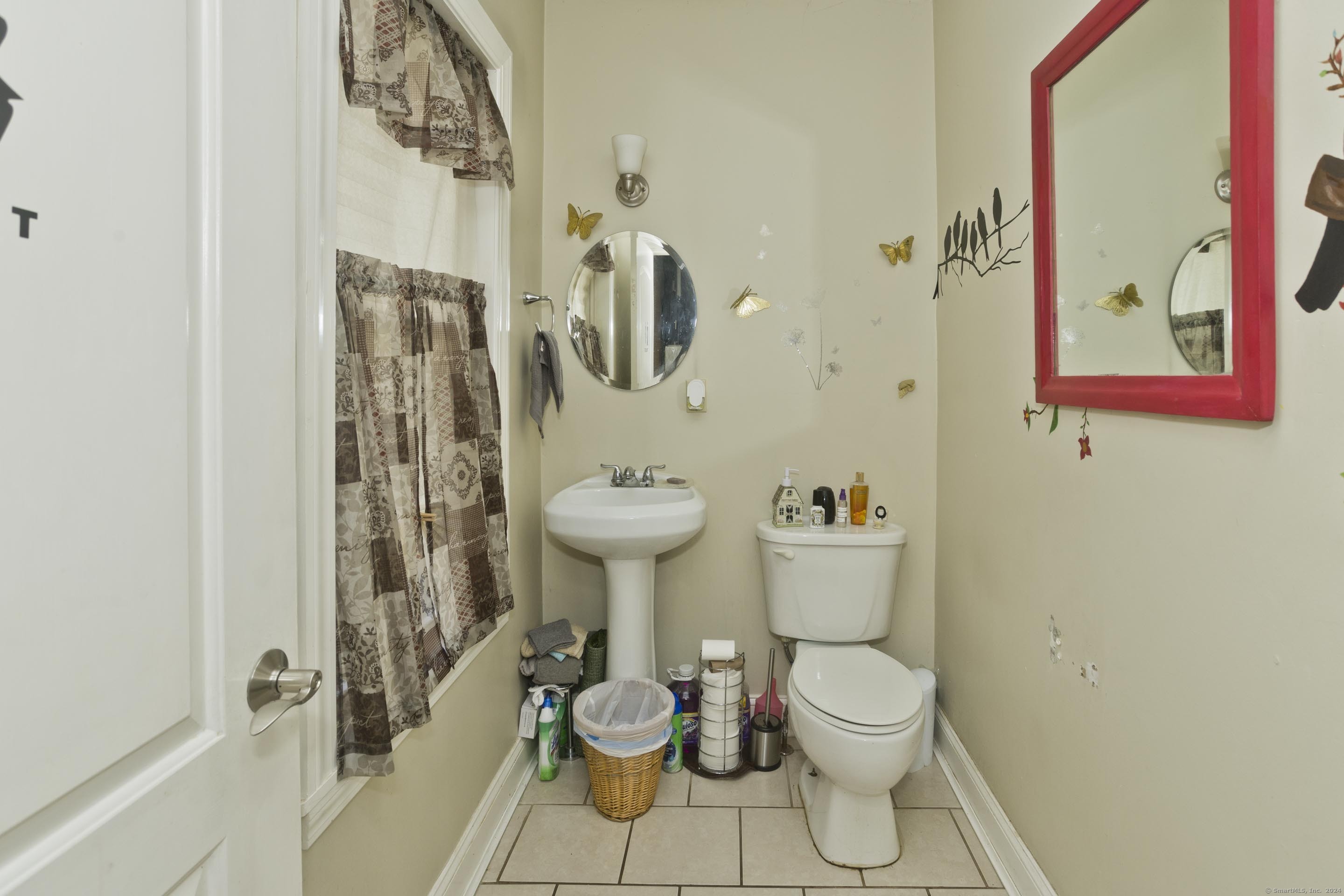 69 Prospect Street Enfield, CT 06082 - Photo 13 of 14 a bathroom with a toilet sink and shower curtain