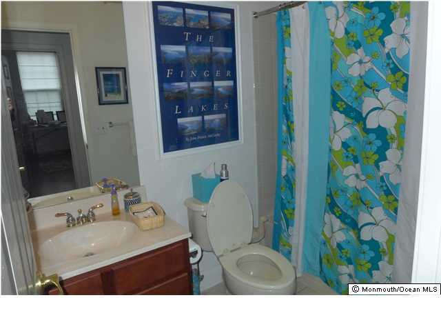 8 Nottingham Way Jackson, NJ 08527 - Photo 12 of 24 a bathroom with a sink and a mirror