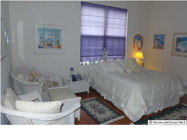 8 Nottingham Way Jackson, NJ 08527 - Photo 14 of 24 a living room with furniture and a lamp
