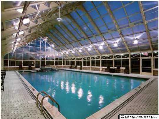 8 Nottingham Way Jackson, NJ 08527 - Photo 18 of 24 a view of a swimming pool with a patio and a yard