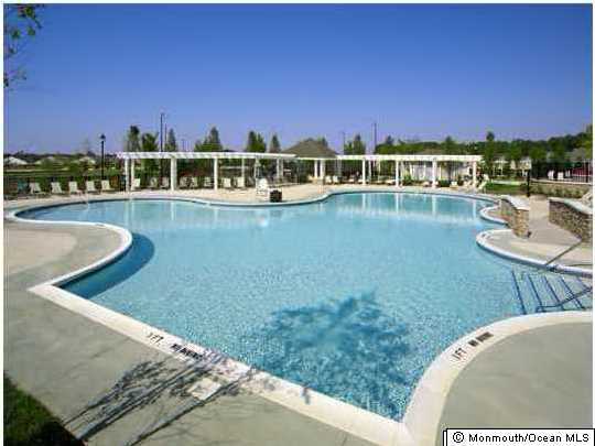 8 Nottingham Way Jackson, NJ 08527 - Photo 19 of 24 a view of a swimming pool with an outdoor seating