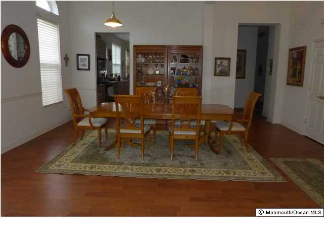 8 Nottingham Way Jackson, NJ 08527 - Photo 7 of 24 a view of dining room and livingroom with furniture wooden floor and a rug