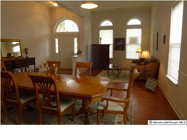 8 Nottingham Way Jackson, NJ 08527 - Photo 8 of 24 a view of a dining room with furniture and a mirror