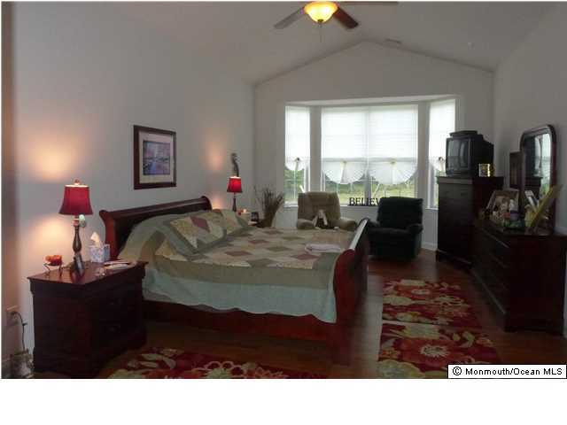 8 Nottingham Way Jackson, NJ 08527 - Photo 10 of 24 a bedroom with a bed and a window