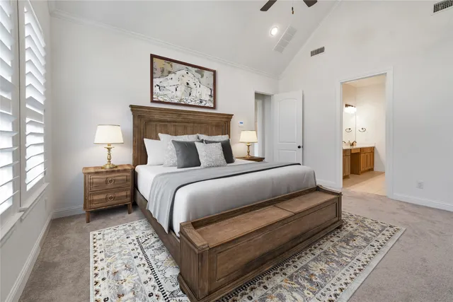 a bedroom with a bed and a couch