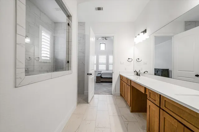 a large white kitchen with a large window