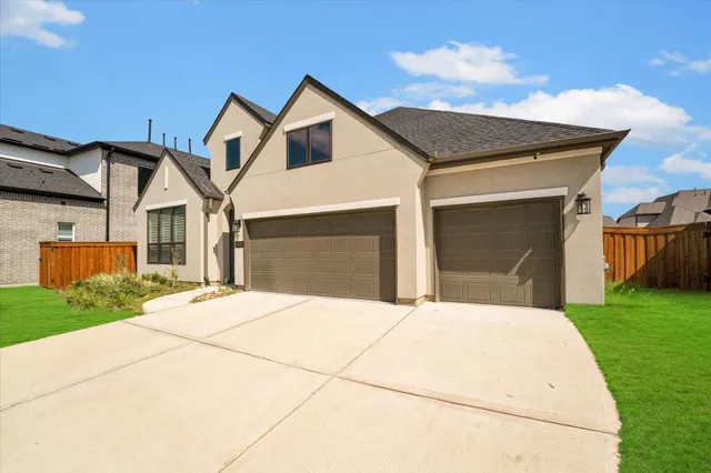 a front view of a house with garage