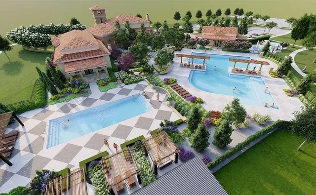 an aerial view of house with yard swimming pool and outdoor seating