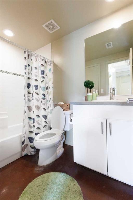 2408 Leon Street, Unit 107 Austin, TX 78705 - Photo 2 of 5 a bathroom with a sink toilet and shower