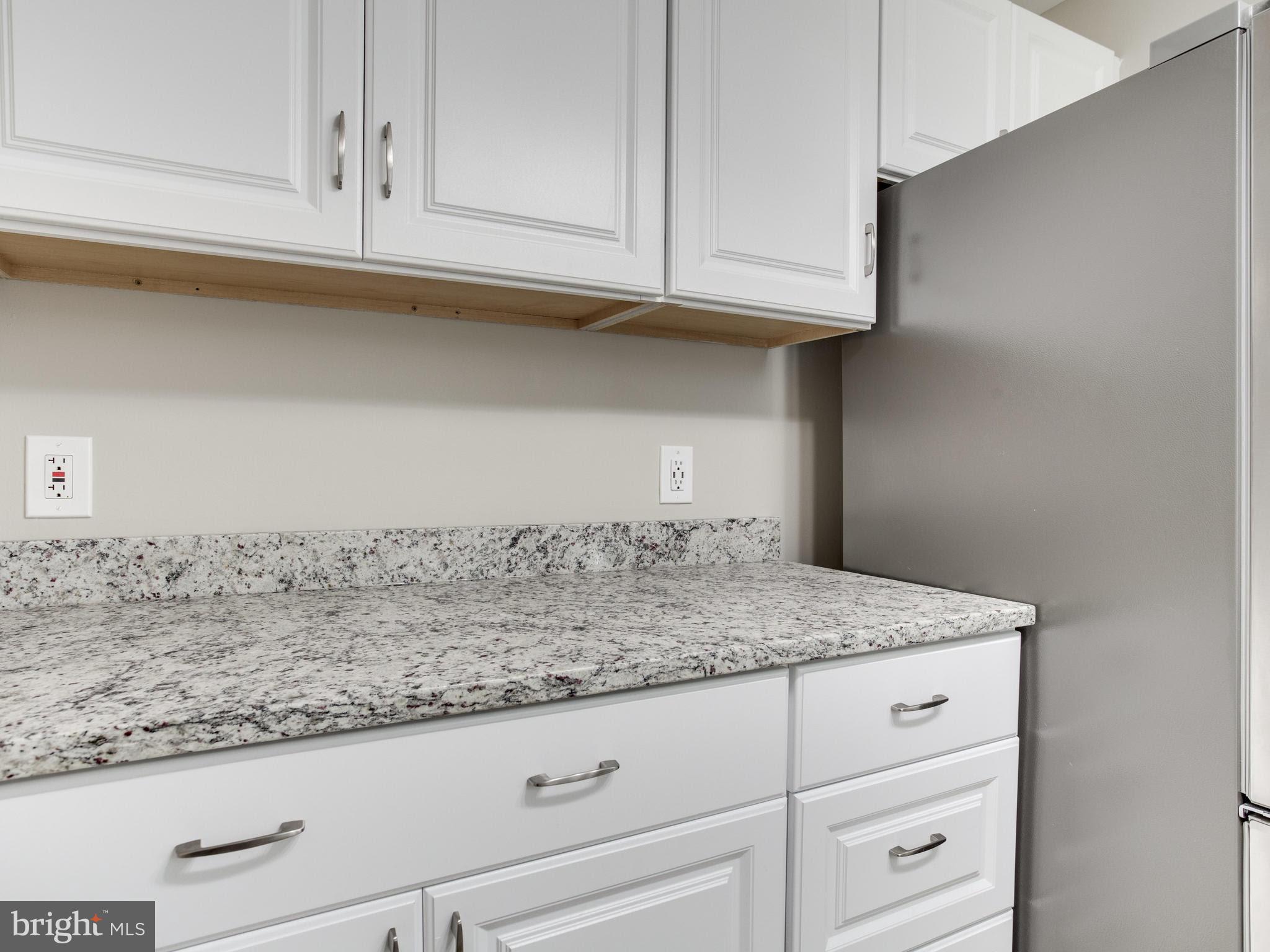 3529 Wild Cherry Road Baltimore, MD 21244 - Photo 11 of 30 a sink with white cabinets