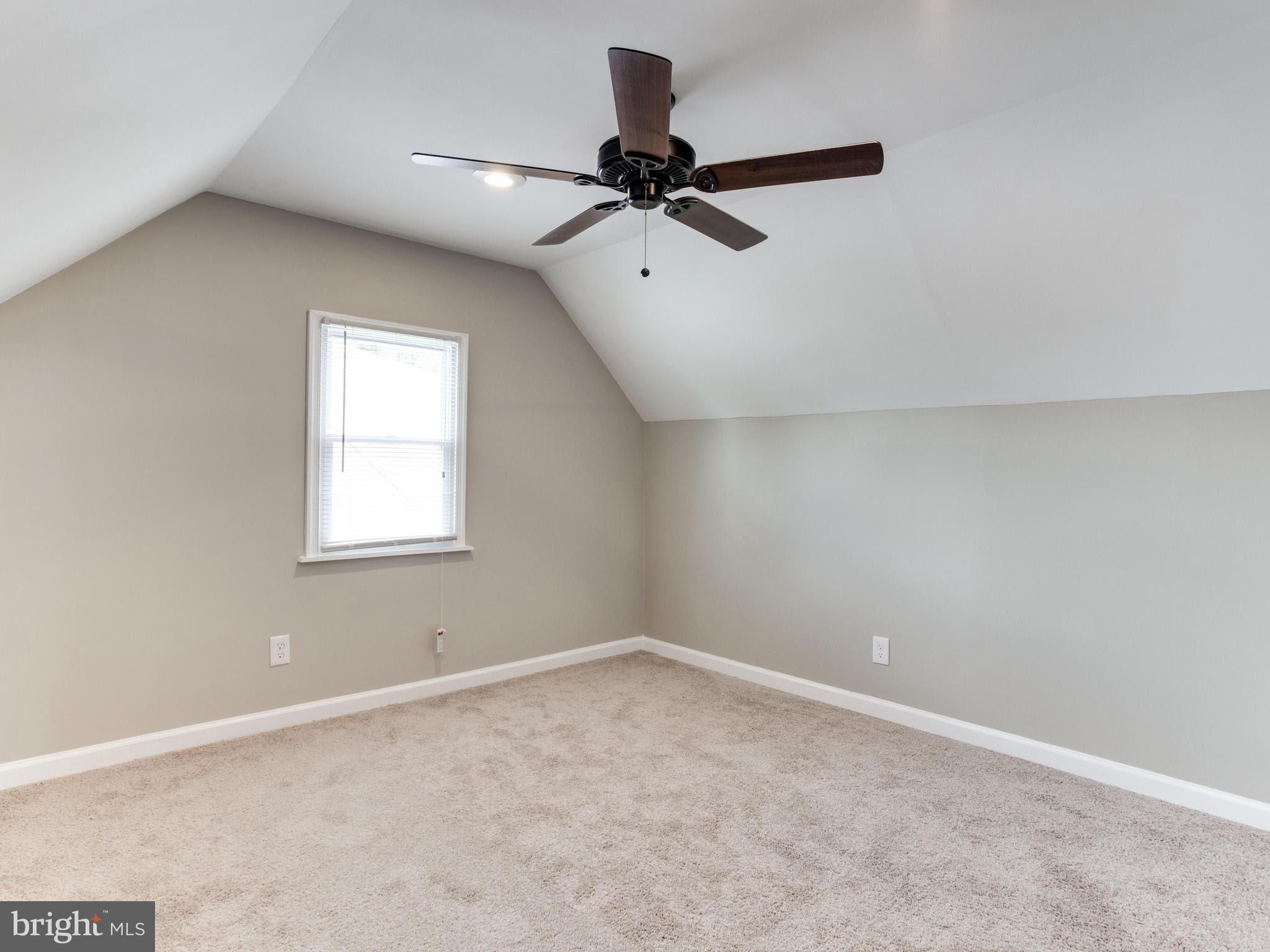 3529 Wild Cherry Road Baltimore, MD 21244 - Photo 22 of 30 an empty room with a window and a fan