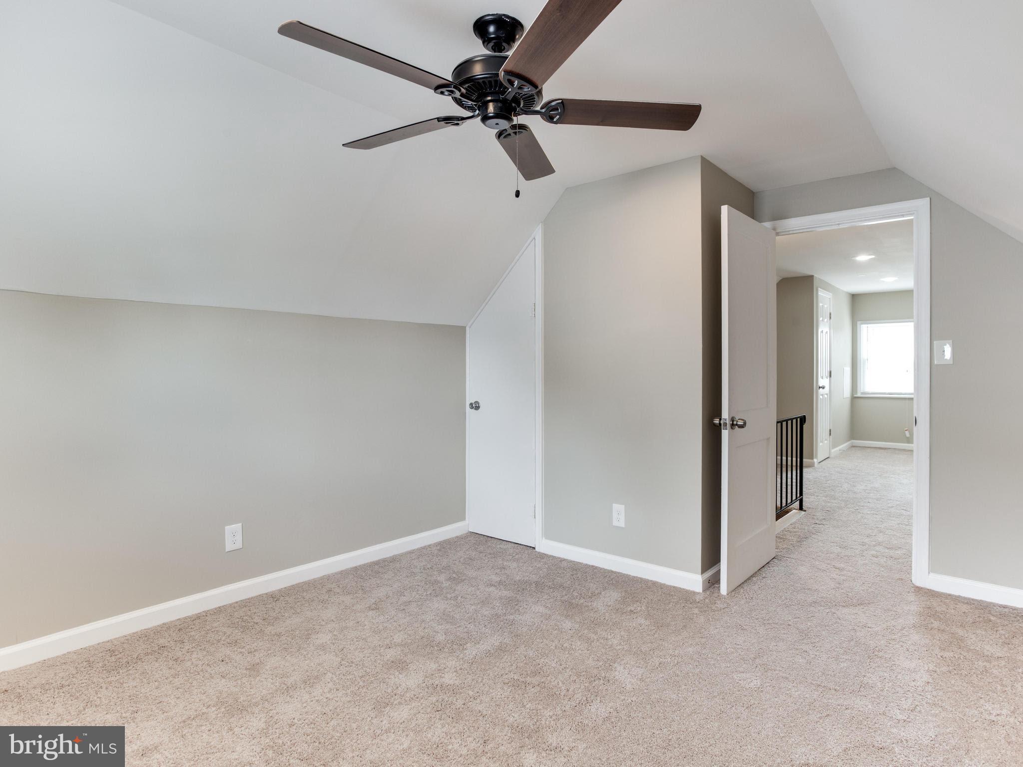 3529 Wild Cherry Road Baltimore, MD 21244 - Photo 23 of 30 a view of a room with a ceiling fan