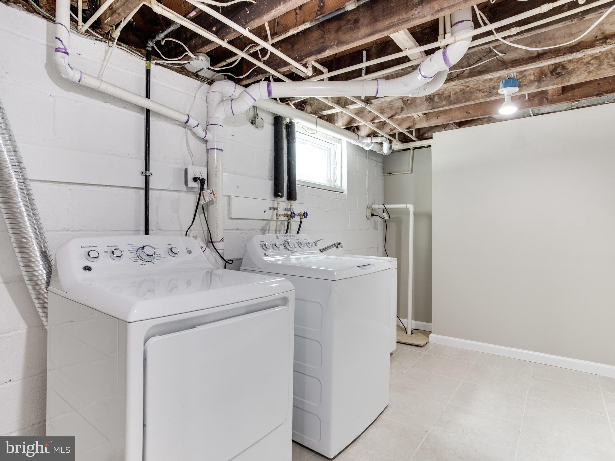 3529 Wild Cherry Road Baltimore, MD 21244 - Photo 27 of 30 a utility room with dryer and washer
