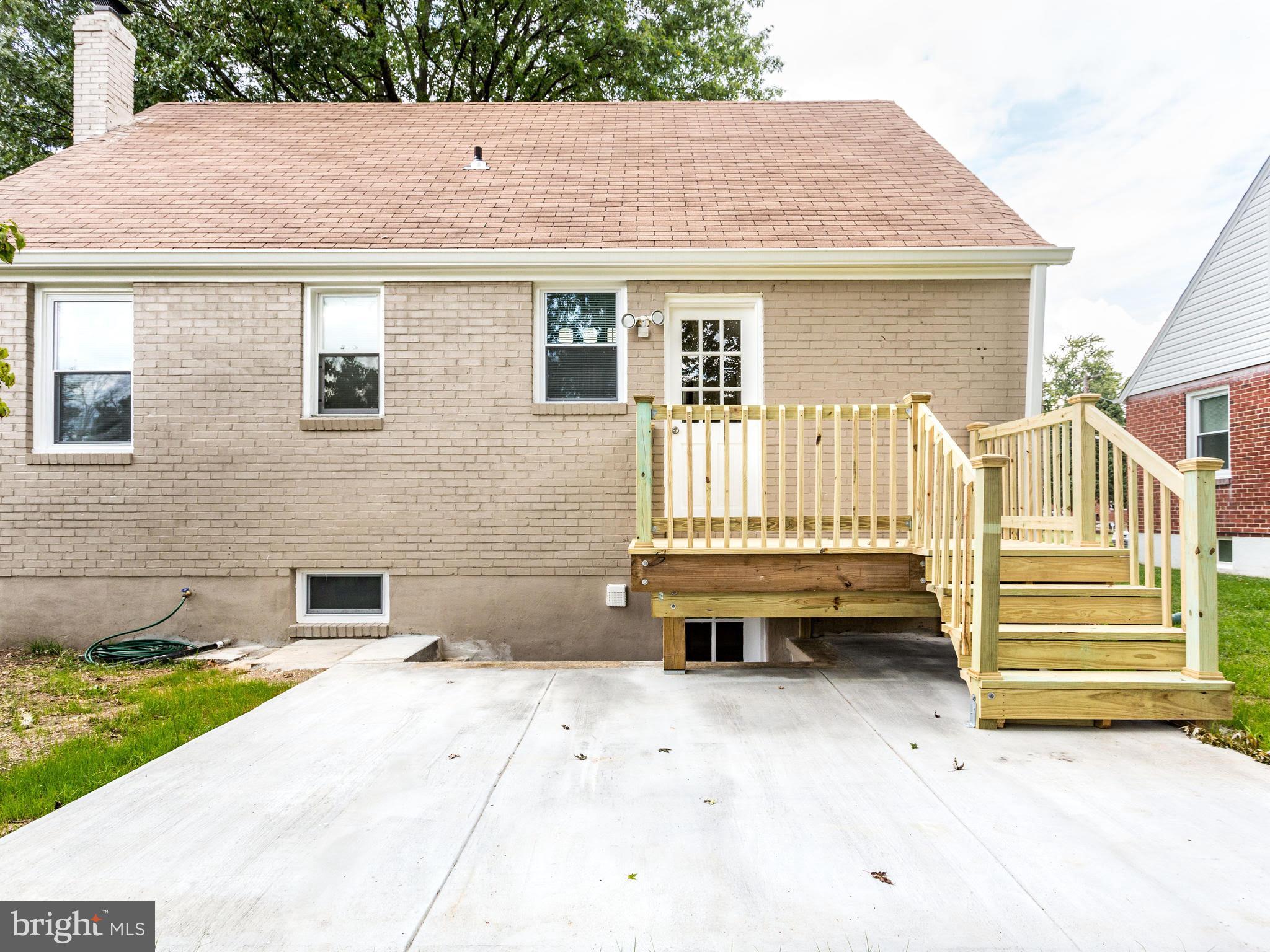 3529 Wild Cherry Road Baltimore, MD 21244 - Photo 29 of 30 a backyard of a house with barbeque oven and wooden fence