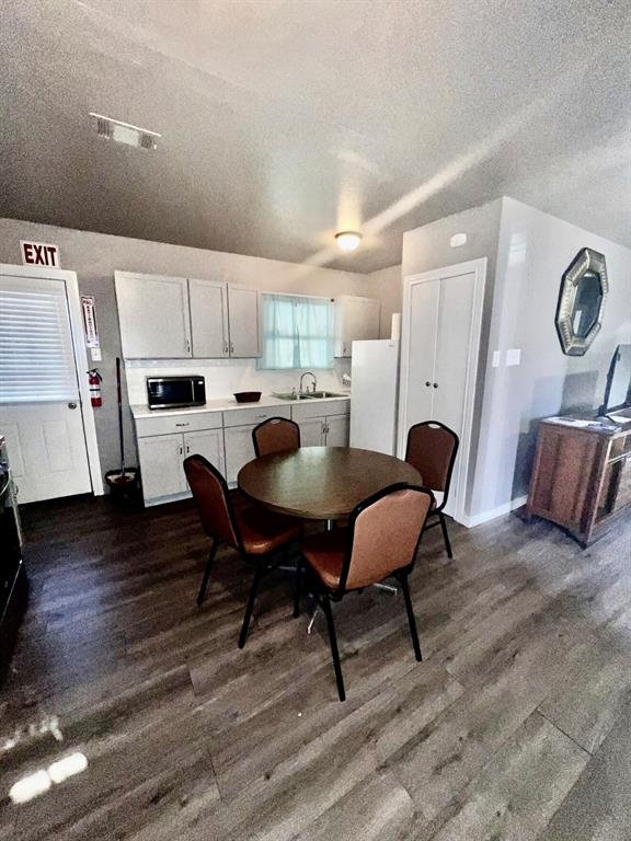 3632 South Marsalis Avenue Dallas, TX 75216 - Photo 4 of 4 a view of kitchen with cabinets and wooden floor