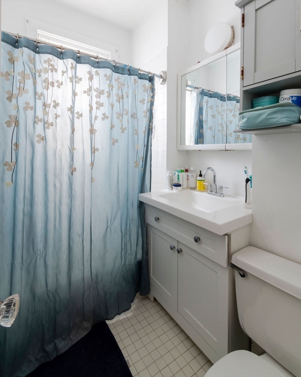 1161 Commonwealth Avenue, Unit 2 Boston, MA 02134 - Photo 13 of 17 a bathroom with a sink toilet and shower