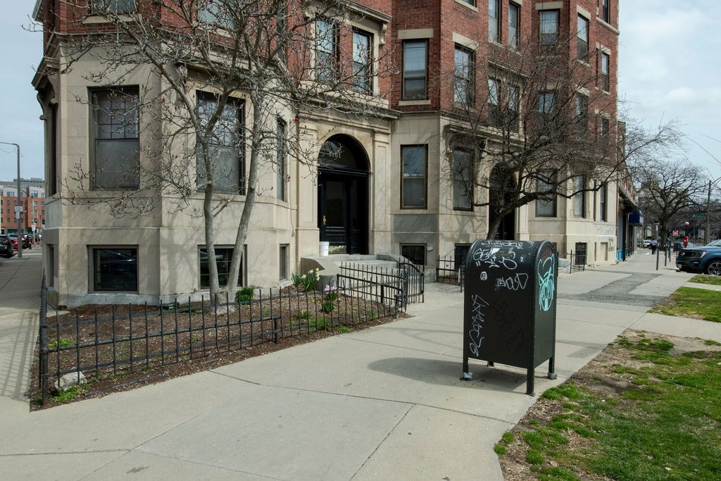 1161 Commonwealth Avenue, Unit 2 Boston, MA 02134 - Photo 14 of 17 a view of a brick building with many windows