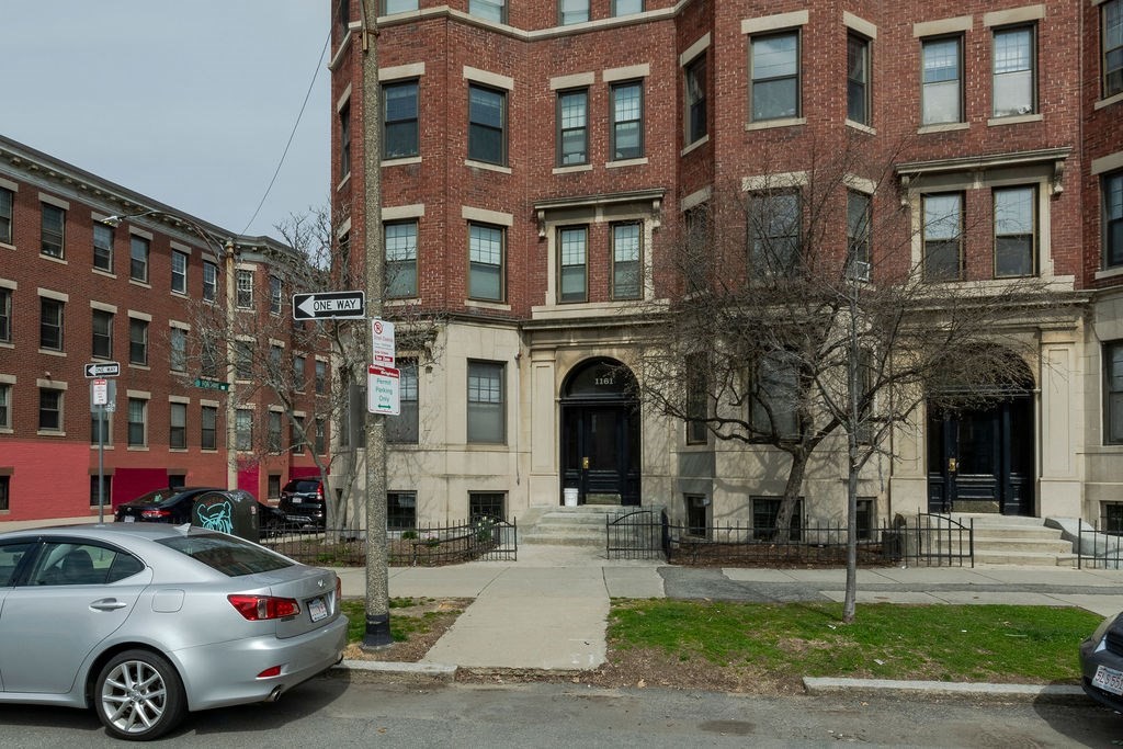 1161 Commonwealth Avenue, Unit 2 Boston, MA 02134 - Photo 16 of 17 a front view of a building with lot of cars and trees