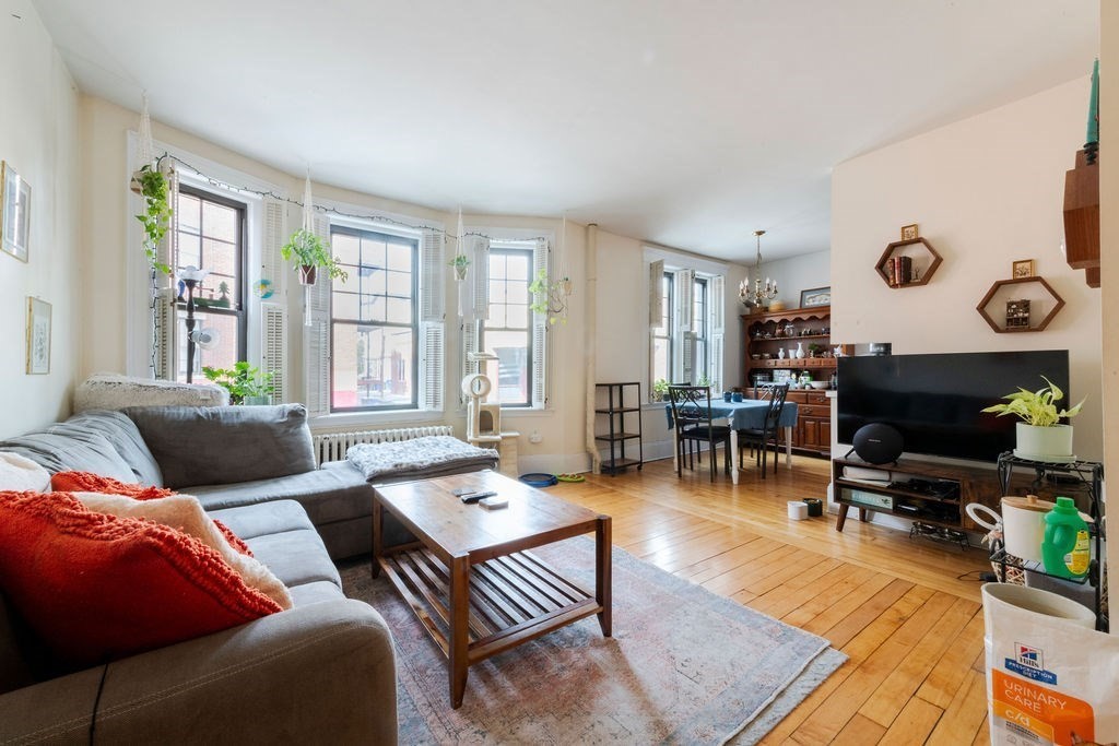 1161 Commonwealth Avenue, Unit 2 Boston, MA 02134 - Photo 3 of 17 a living room with furniture and wooden floor