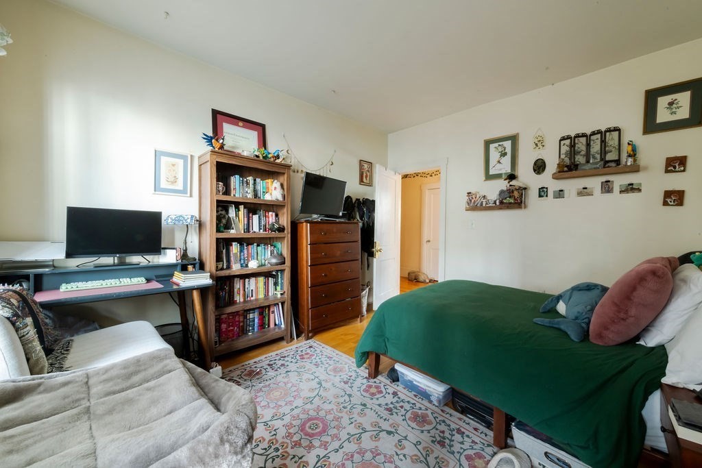 1161 Commonwealth Avenue, Unit 2 Boston, MA 02134 - Photo 10 of 17 a living room with furniture and a flat screen tv