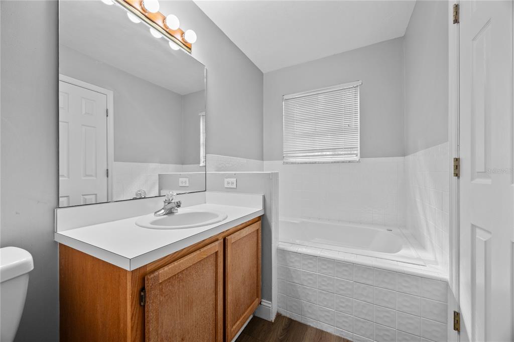 5291 Southwest 97 Way Gainesville, FL 32608 - Photo 17 of 24 a bathroom with a sink and a bathtub