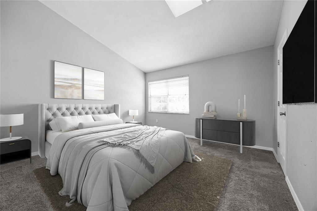 5291 Southwest 97 Way Gainesville, FL 32608 - Photo 18 of 24 a bedroom with a bed and a flat screen tv