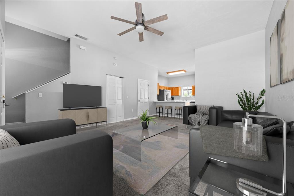 5291 Southwest 97 Way Gainesville, FL 32608 - Photo 5 of 24 a living room with furniture and a flat screen tv