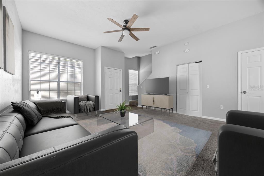 5291 Southwest 97 Way Gainesville, FL 32608 - Photo 7 of 24 a living room with furniture and a large window