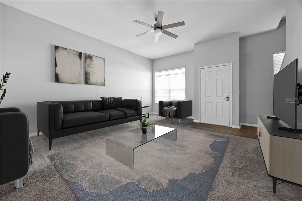 5291 Southwest 97 Way Gainesville, FL 32608 - Photo 8 of 24 a living room with furniture and a flat screen tv