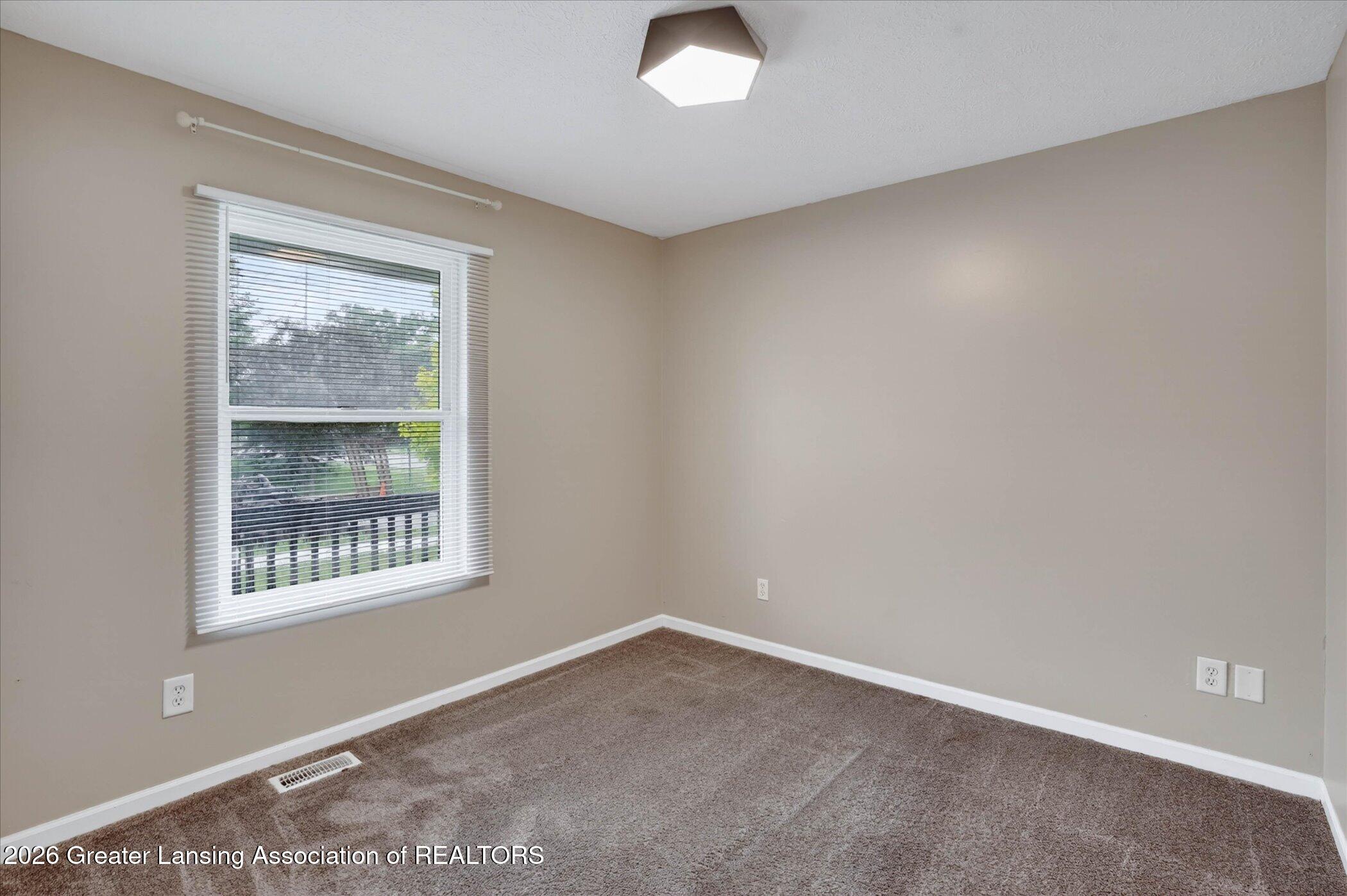 5105 Hughes Road Lansing, MI 48911 - Photo 14 of 26 23-5105-Hughes-Rd-WindowStill-Photograph