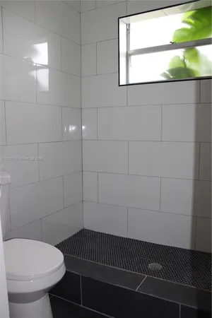 a bathroom with a toilet and a sink