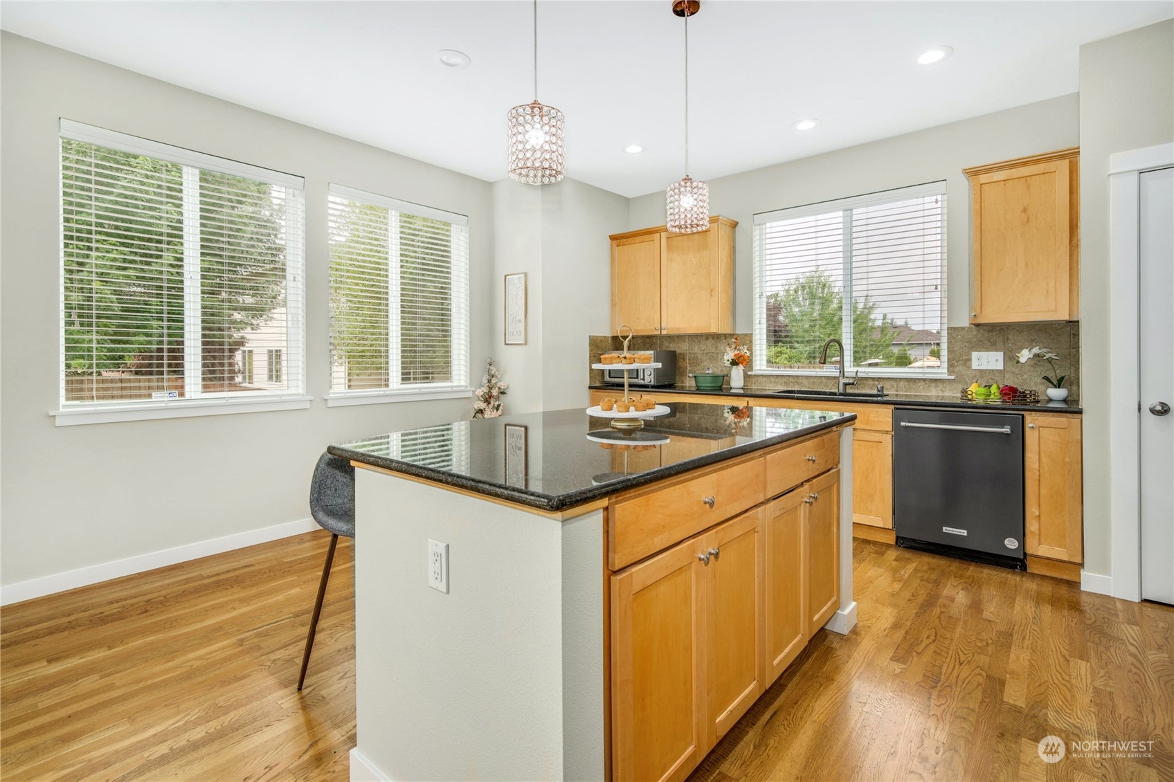3604 222nd Place Southeast Bothell, WA 98021 - Photo 11 of 38 a kitchen with granite countertop a sink appliances cabinets and a counter top space