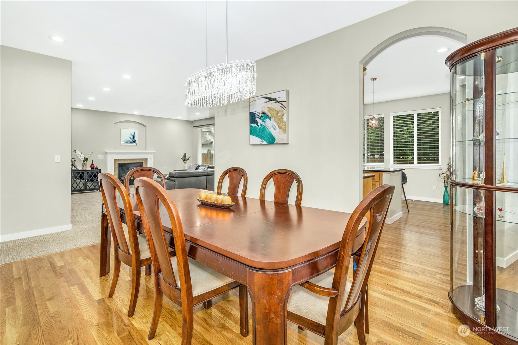 3604 222nd Place Southeast Bothell, WA 98021 - Photo 14 of 38 a view of a dining room with furniture a chandelier and wooden floor