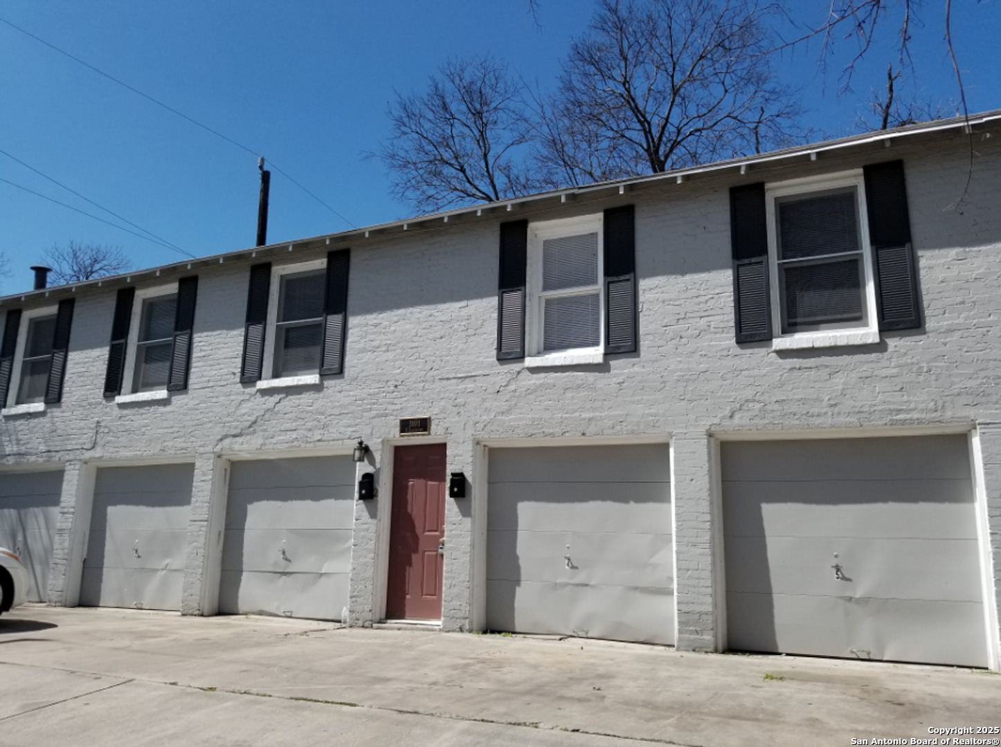 a front view of a house with a garage