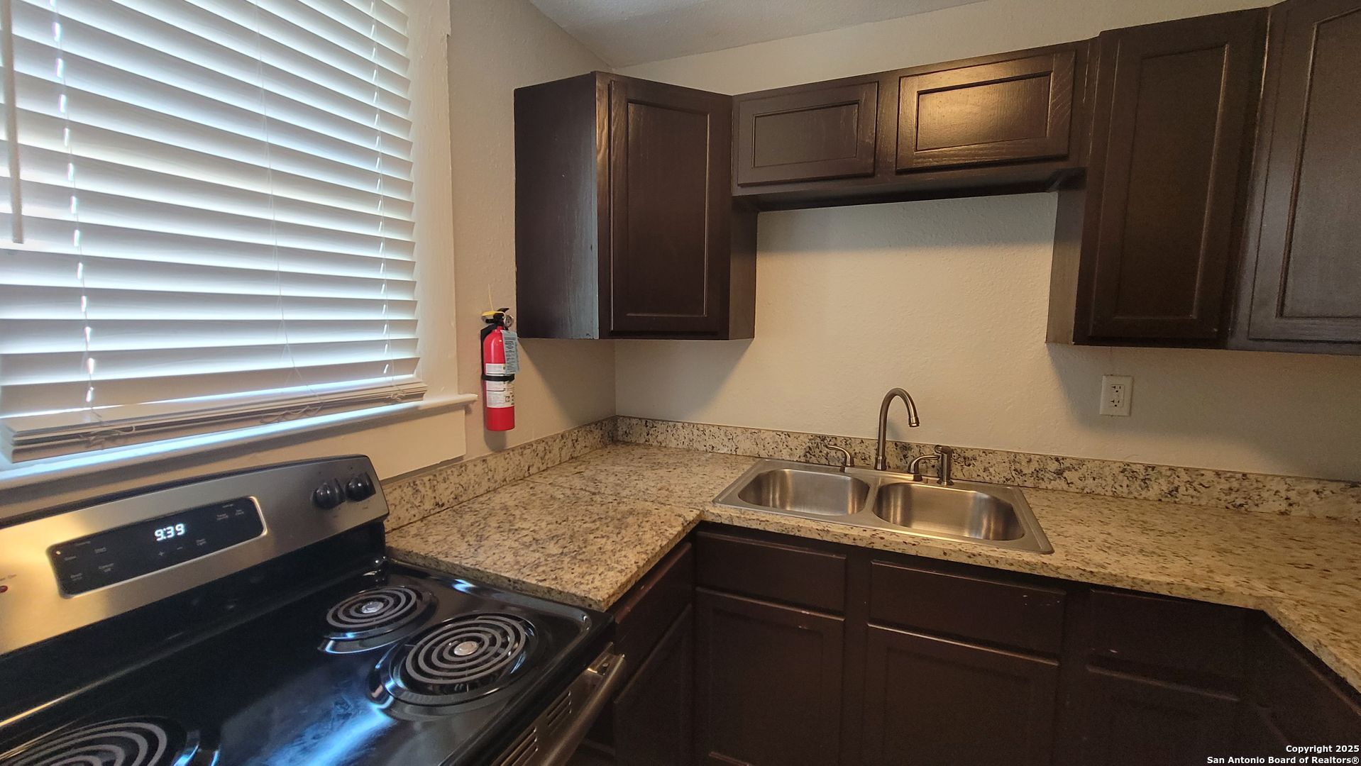 3101 North Elmendorf Street, Unit 2 San Antonio, TX 78201 - Photo 9 of 11 a kitchen with a sink stove and microwave