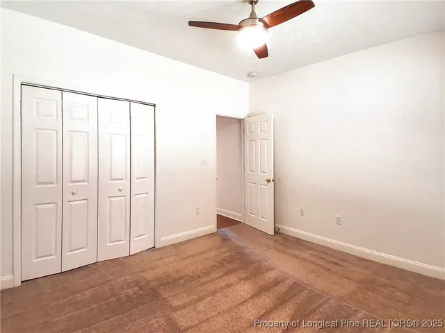 an empty room with fan