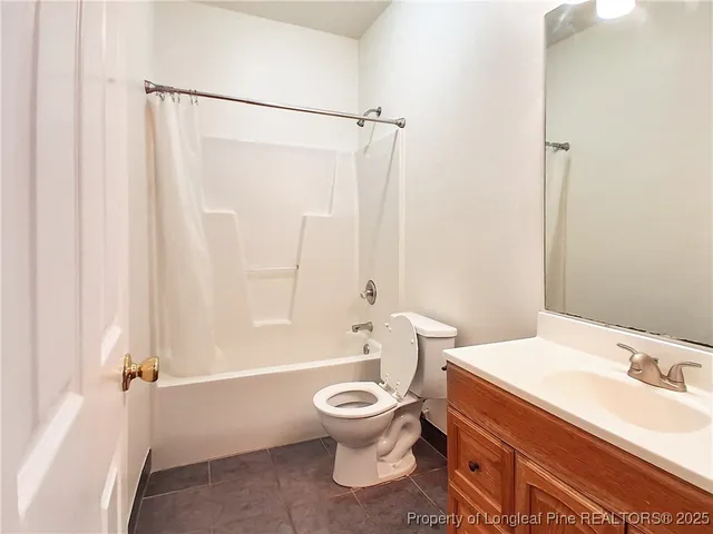 a bathroom with a toilet a sink and a bathtub