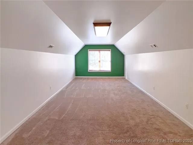 a view of a hallway with a window