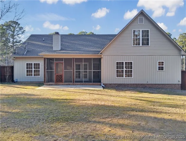 a view of a house with a swimming pool and a chair